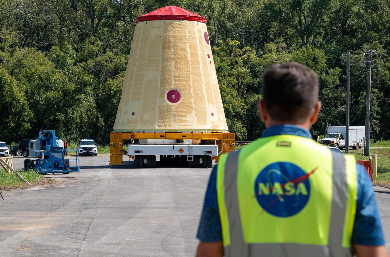 NASA rolled out a key piece of space flight hardware for the SLS (Space Launch System) rocket for the first crewed mission of NASA’s Artemis campaign from Marshall Space Flight Center in Huntsville, Alabama, on Wednesday, Aug. 21 for shipment to the agency’s spaceport in Florida. The cone-shaped launch vehicle stage adapter connects the rocket’s core stage to the upper stage and helps protect the upper stage’s engine that will help propel the Artemis II test flight around the Moon, slated for 2025. Manufactured by prime contractor Teledyne Brown Engineering and the Jacobs Space Exploration Group’s ESSCA (Engineering Services and Science Capability Augmentation) contract using NASA Marshall’s self-reacting friction-stir robotic and vertical weld tools. Crews moved the adapter out of NASA Marshall’s Building 4708 to the agency’s Pegasus barge Aug. 21. The barge will ferry the adapter first to NASA’s Michoud Assembly Facility in New Orleans, where crews will pick up additional SLS hardware for future Artemis missions, before traveling to NASA Kennedy. Once in Florida, the adapter will join the recently delivered core stage. There, teams with NASA’s Exploration Ground Systems will prepare the adapter for stacking and launch.